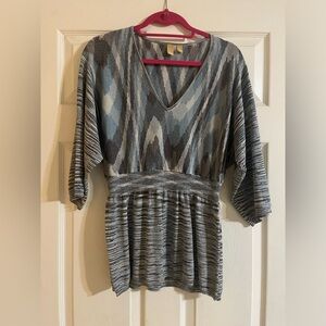 Fit and flare shimmery metallic knit v-neck top
